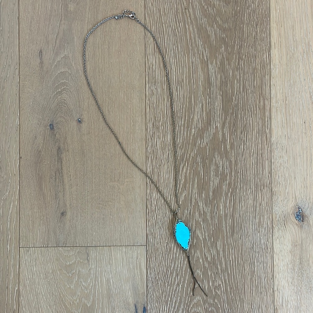 A Silver Necklace with a Turquoise Stone